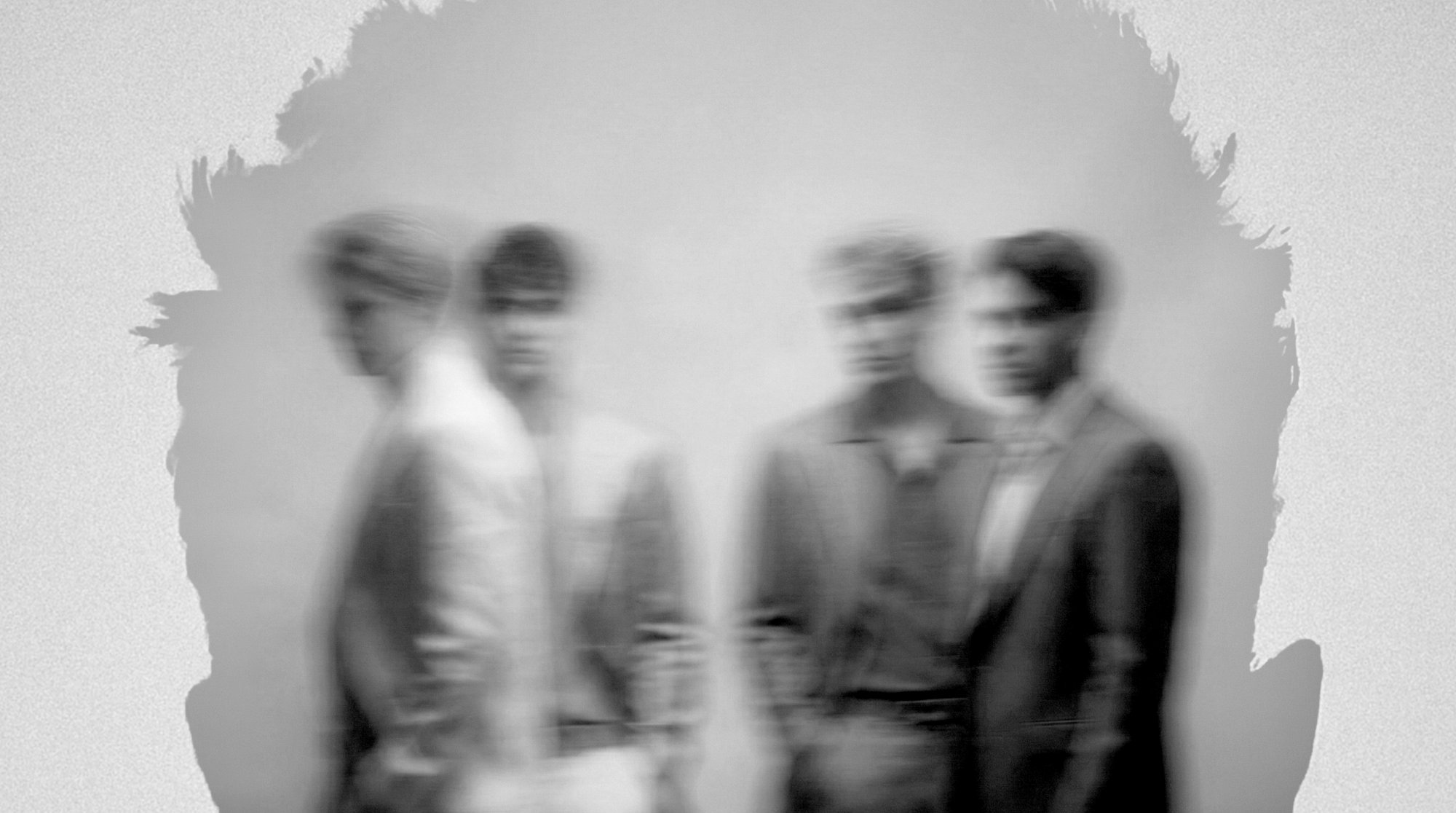 Abstract blurred figures in black and white, brand consistency across multiple international markets